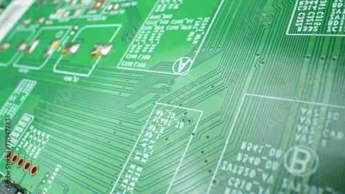 A Printed Circuit Board (PCB) is a vital electronic component, featuring interconnected conductive pathways. It facilitates electronic device functionality. Video footage. Innovation concept.
 photo