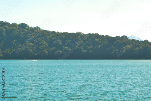 Natural Scenery Of A Mountainous Area With A Lake And Forested Trees, Located At Beratan Lake In Bedugul, Bali, Indonesia