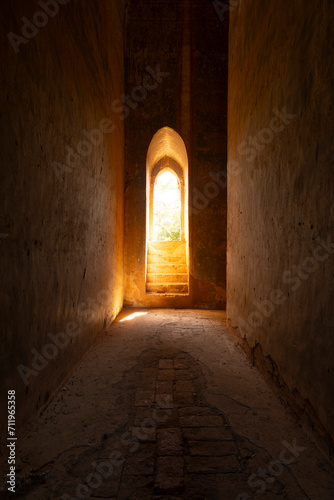 A huge window mysteriously lets light into one of the lonely temples of Bagan, Myanmar