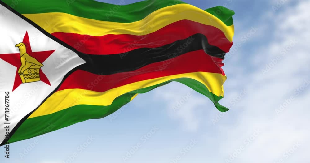 Close-up view of the Zimbabwe national flag waving in the wind