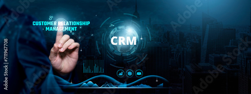 Customer Relationship Management (CRM), Data-driven Engagement, Strategic Connections, Businessman touch CRM-related text on the global network cyberspace, technology, and innovation concept. photo