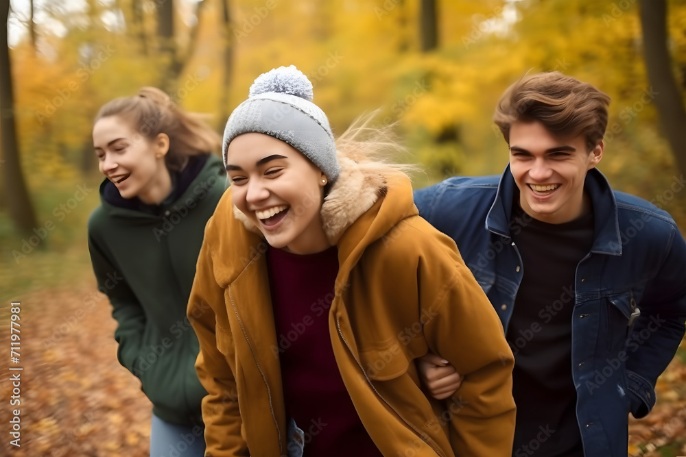 warm moment of friendship. It shows four individuals, arm in arm, enjoying an autumn day outdoors typical of autumn warm moment of friendship. It shows four individuals, arm in arm, enjoying an autumn day outdoors typical of autumn