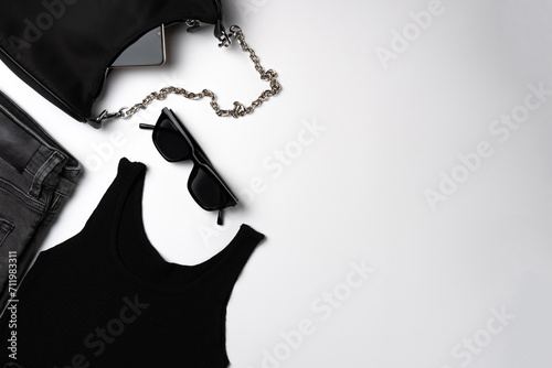 Collection of black women's clothing isolated white background photo