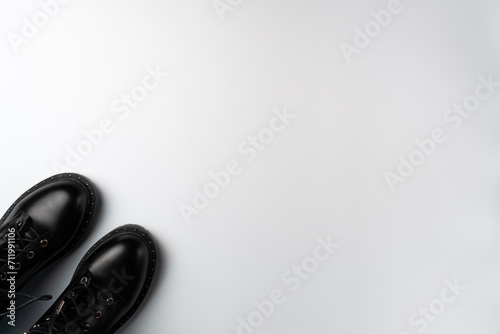 Black boots on a white background. Copy space
