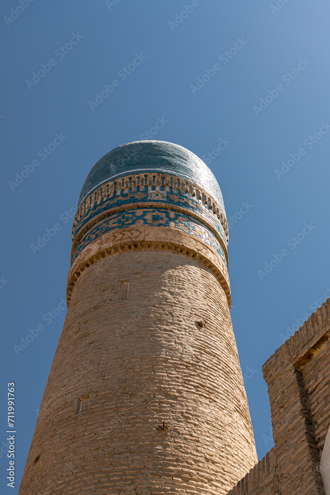 Old Madrasah Chor Minor in Bukhara with blue domes.