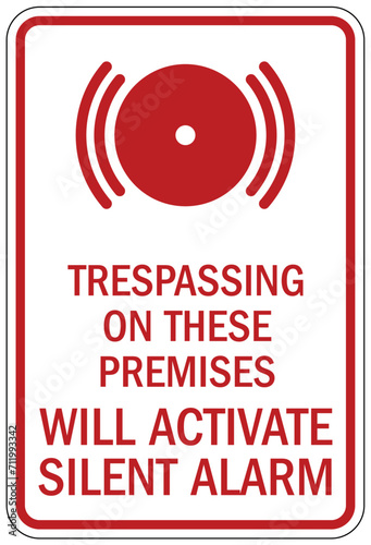 Security alarm sign trespassing on these premises will activate silent alarm