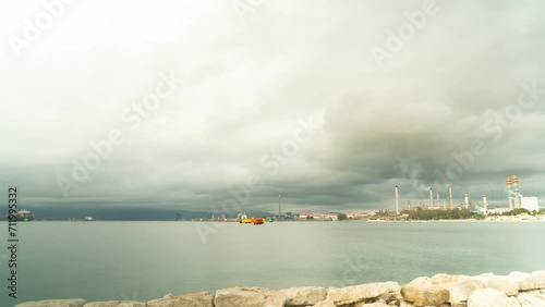 Industrial vessel and smoking factory near Gibraltar port, time lapse view