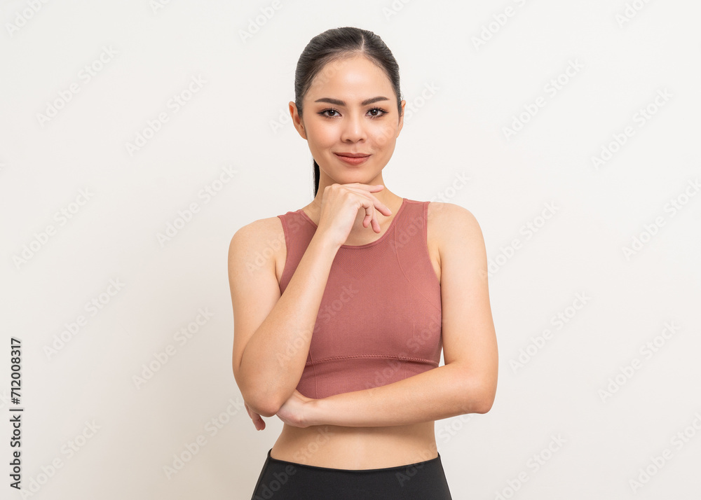 Young beautiful smiling asian woman with sportswear on isolated white background. Portrait happy healthy slim fit and firm latin attractive sporty woman standing pose exercise workout in studio. Young beautiful smiling asian woman with sportswear on isolated white background. Portrait happy healthy slim fit and firm latin attractive sporty woman standing pose exercise workout in studio.