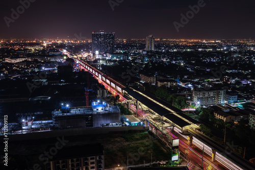 long exposure shot cityscape and electric train station at nighttime 