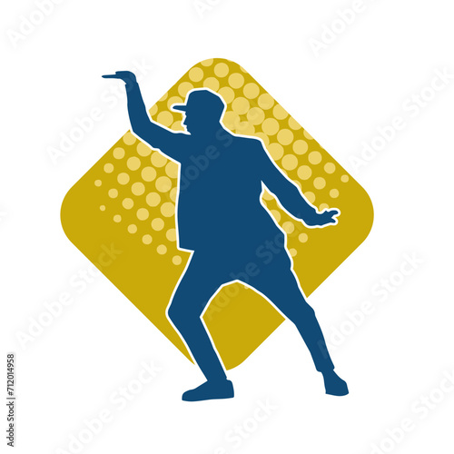 Silhouette of a man in dancing pose. Silhouette of a male dancer in performing pose.
