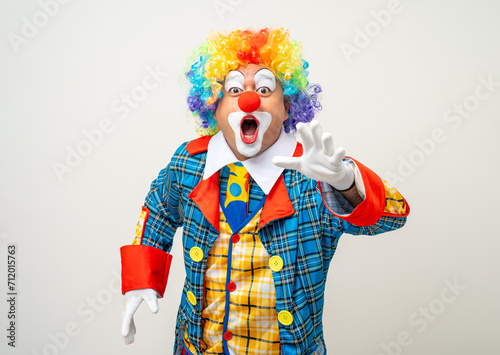 Mr Clown. Portrait of Funny face Clown man in colorful uniform standing variety action. Happy expression male bozo in various pose on isolated background. © Chanakon