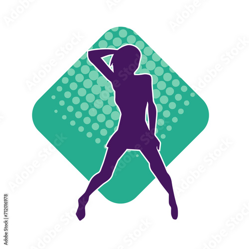 Silhouette of a slim female in dance pose. Silhouette of a woman dancing.