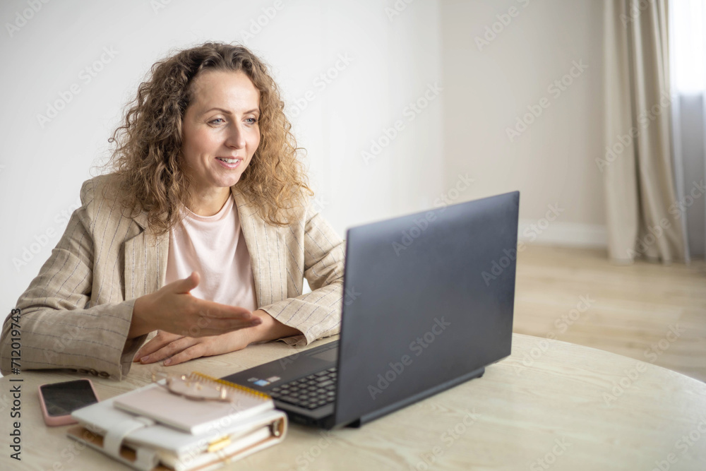 Modern business woman working online use laptop making notes e learning distance education at home Modern business woman working online use laptop making notes e learning distance education at home