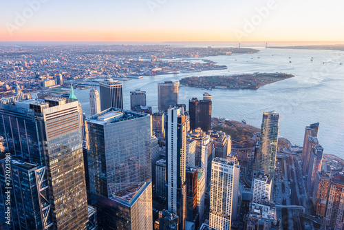 Skyline of Manhattan New York City during sunset. View of financial district and Governors Island.