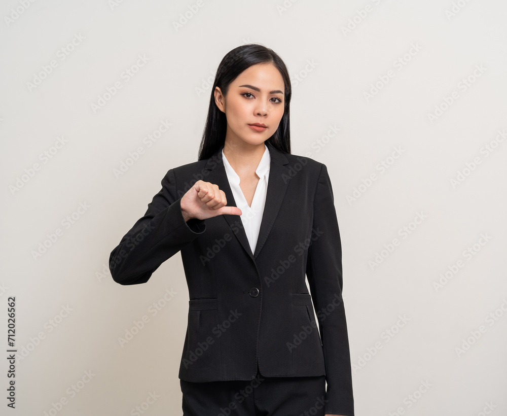 Angry asian woman emotional showing thumbs down. Asian business woman annoyed mad bad furious gesture. Unhappy expressions people upset confused emotional. Stressed feeling depressed dramatic scene Angry asian woman emotional showing thumbs down. Asian business woman annoyed mad bad furious gesture. Unhappy expressions people upset confused emotional. Stressed feeling depressed dramatic scene
