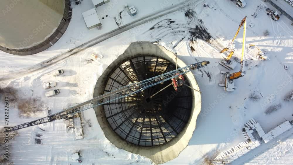 Top View Of Industrial Cooling Tower Being Demolished In Winter. Czech Republic. aerial shot Top View Of Industrial Cooling Tower Being Demolished In Winter. Czech Republic. aerial shot