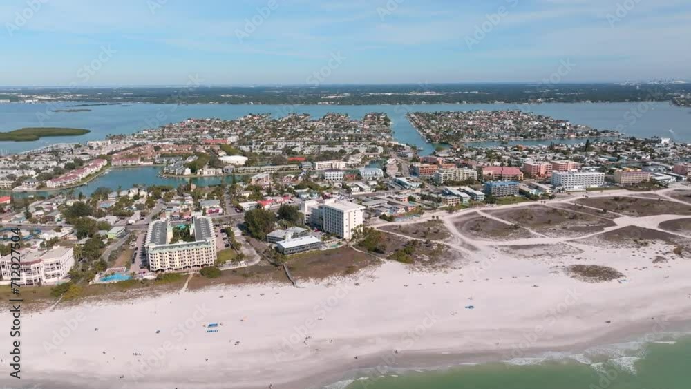 Aerial drone panning view of beach condos and house on Madeira beach, FL Aerial drone panning view of beach condos and house on Madeira beach, FL
