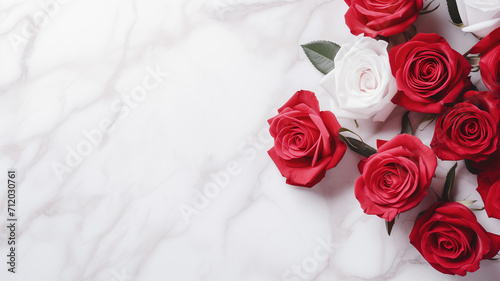 Roses scattered on a white Carrara marble  emphasizing contrast and elegance. 