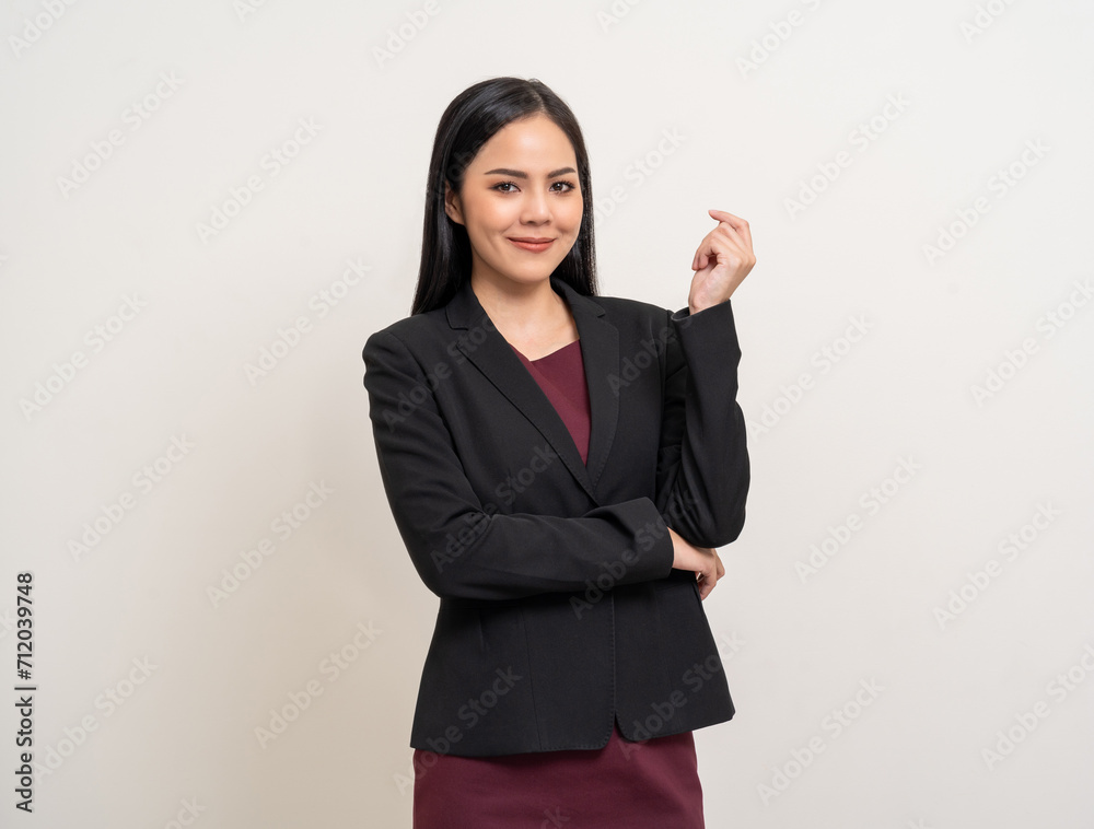 Attractive Young asian business woman smiling to camera standing pose on isolated white background. Latin Female around 25 in black suit portrait shot in studio. Attractive Young asian business woman smiling to camera standing pose on isolated white background. Latin Female around 25 in black suit portrait shot in studio.