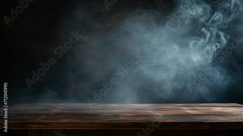 On a black background  an empty wooden table with smoke floats up. Empty space for displaying your products  with a smoke float up on a dark background. 