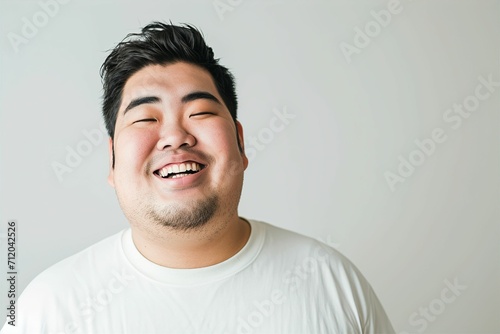 太っている日本人男性のポートレート（デブ・肥満・減量・ぽっちゃり・ダイエット・フィットネス） photo