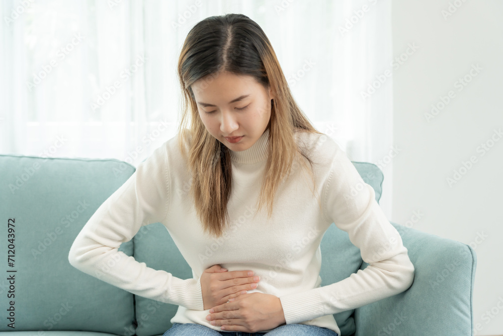 stomach ache. Asian women have abdominal pain, indigestion, gastritis, menstrual cramps, flatulence, diarrhea, distention, colon cancer, belly inflammation problem, suffer food poisoning, abdomen stomach ache. Asian women have abdominal pain, indigestion, gastritis, menstrual cramps, flatulence, diarrhea, distention, colon cancer, belly inflammation problem, suffer food poisoning, abdomen