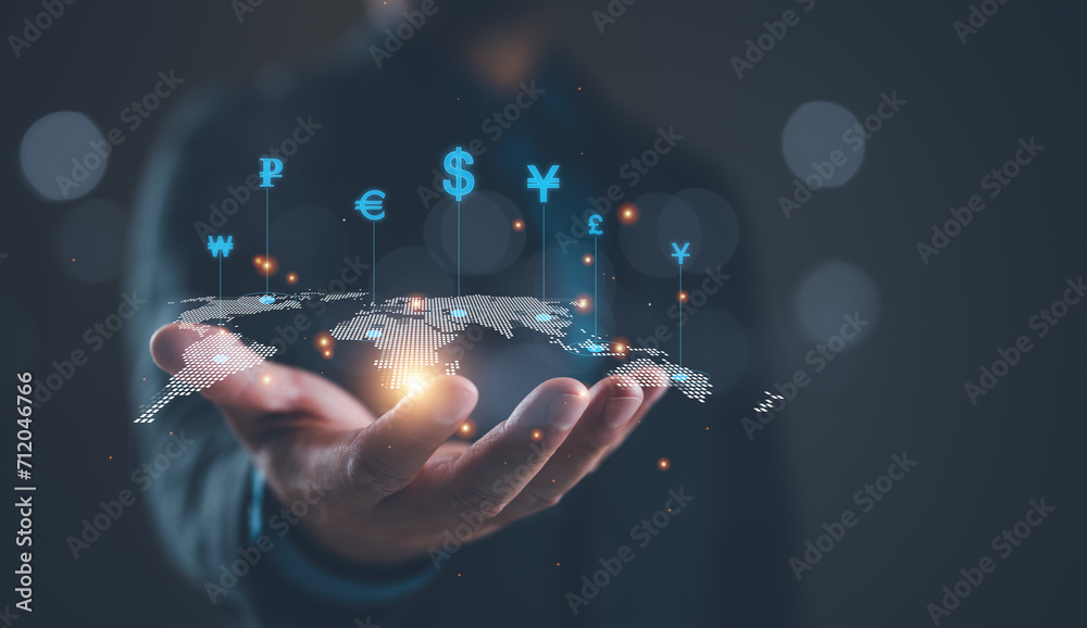 Global currency exchange concept, Businessman holding virtual world map and dollar yuan yen euro and pound sterling sign. Global business, international trading currency, world economy money, transfer - obrazy, fototapety, plakaty 