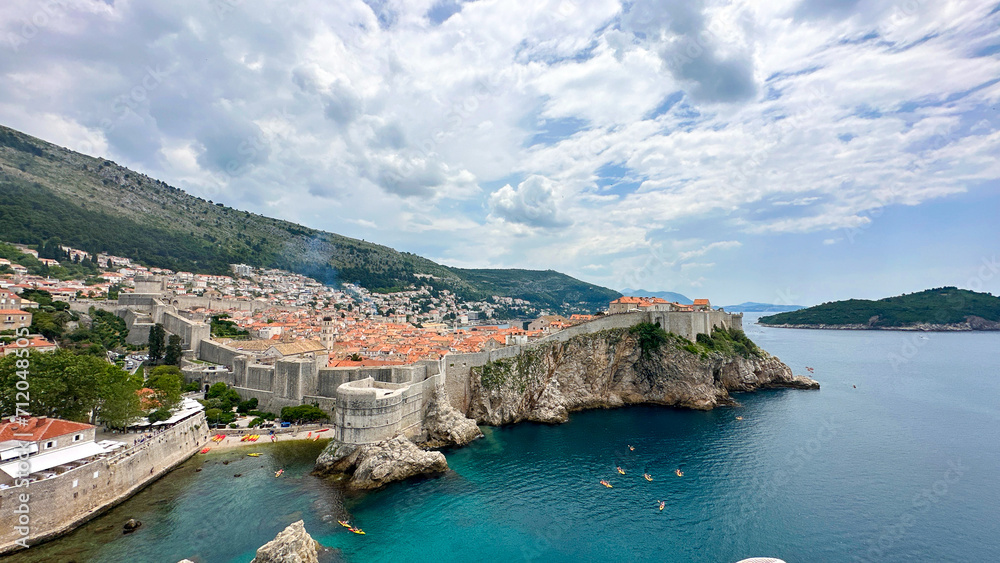 Beautiful Dubrovnik Croatia showing the city walls and Adriatic ocean taken at mid day with clouds.