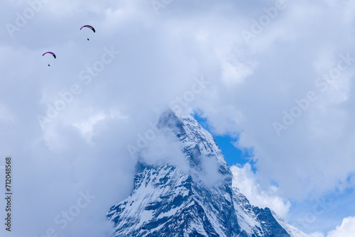 Matterhorn Switzerland seen from Zermatt with Parapenter flying nearby.