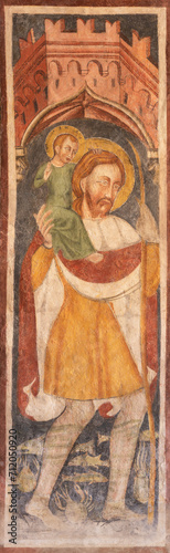 TREVISO, ITALY - NOVEMBER 8, 2023: The fresco of St. Cristopher in the church Chiesa di San VIto e Santa Lucia by unknown artist from 13. cent..