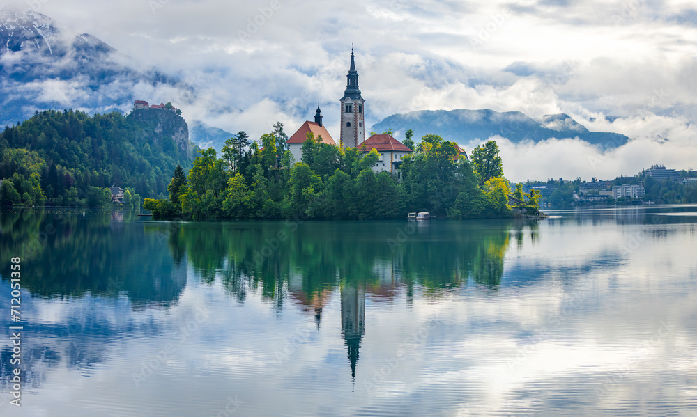 Lake Bled Slovenia with the small island in the middle of the lake and the old church. 
