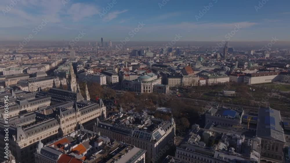 Aerial panoramic view of metropolis on sunny winter morning without snow. Historic building of City hall and markets in park. Vienna, Austria Aerial panoramic view of metropolis on sunny winter morning without snow. Historic building of City hall and markets in park. Vienna, Austria