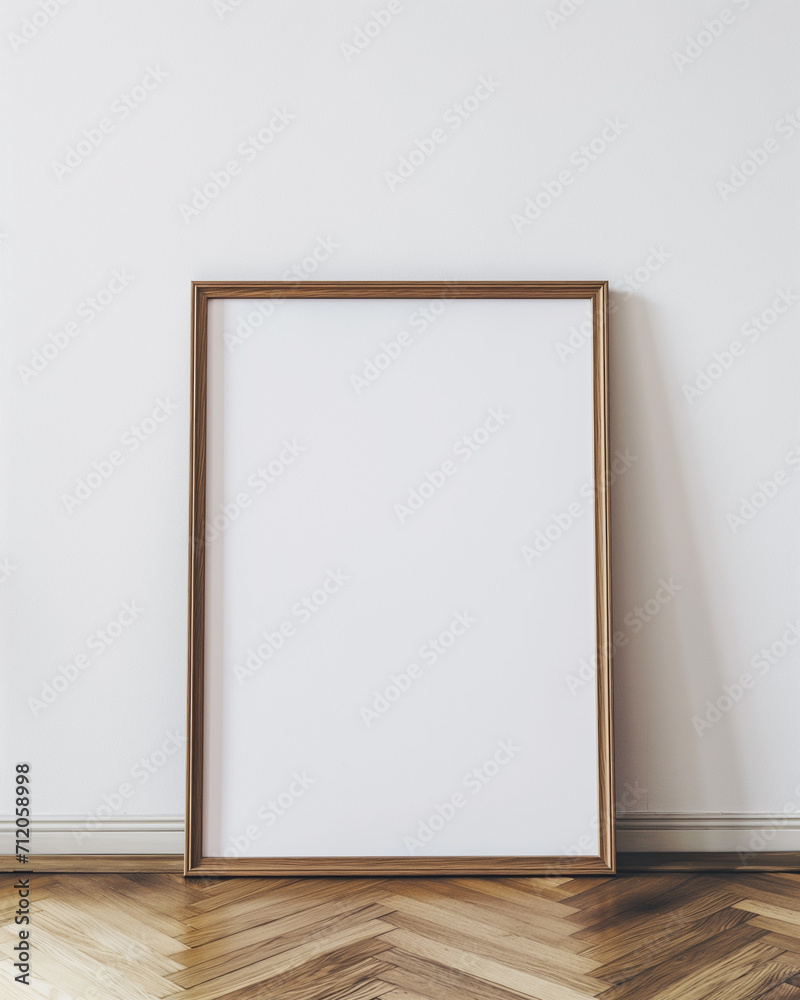 mockup of a blank large light oak frame leaning against a white wall. mockup of a blank large light oak frame leaning against a white wall.