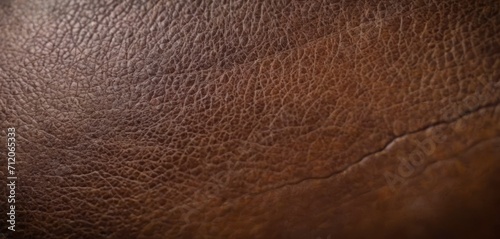  a close up view of a brown leather texture with a light reflection of the light coming from the top part of the leather, and the top part of the top part of the leather.