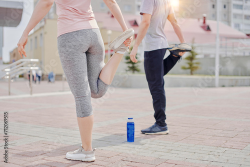 Man and woman exercising outdoor in summer © sata_production