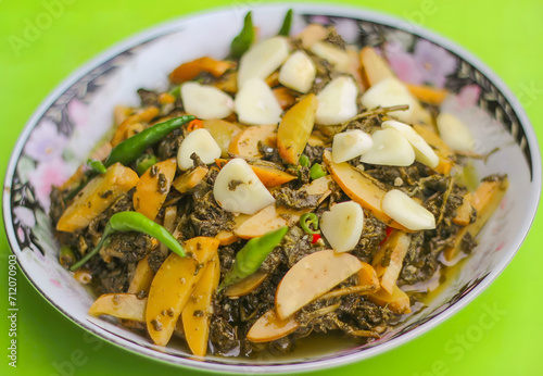 Burmese, Myanmar tea leaf salad called Lahpet thoke recipe with Djenkol Bean slices.