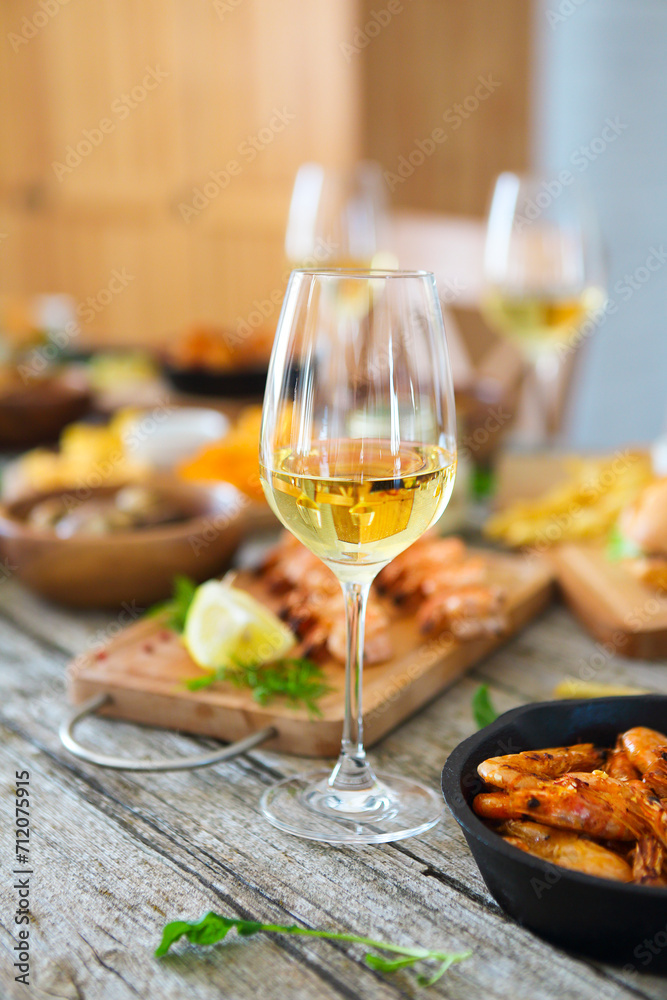 Glass of white wine on dinner table