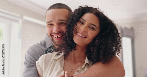 Face, home and hug with couple, love and funny with marriage, relationship and trust in a lounge. Portrait, man and woman with a smile, happiness and romantic with humor, laughing or embrace with joy photo