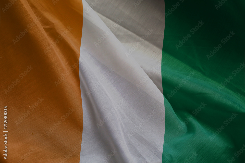 Obraz premium national wavy fabric flag of IVORY COAST