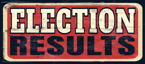 Aged and worn election results sign on wood