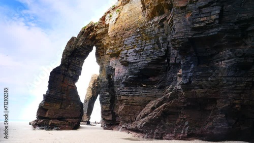 Beach of the Cathedrals, Playa las Catedrales in Ribadeo, province of Lugo, Galicia. Cliff formations on Cantabric coast in northern Spain. Tourist attraction. photo