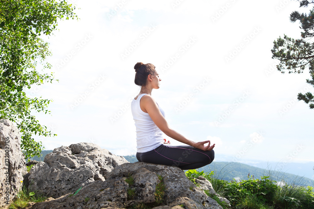 Attractive young woman doing a yoga pose Attractive young woman doing a yoga pose