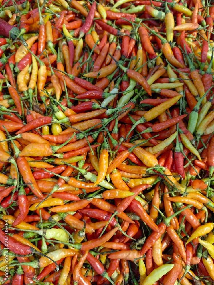 pile of fresh chilies in a basket pile of fresh chilies in a basket