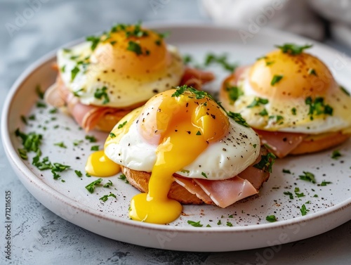 Classic eggs benedict on a minimalist plate