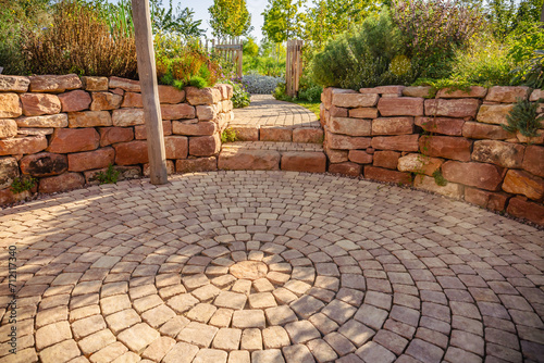 Sunny garden patio with sitting area and herbal garden