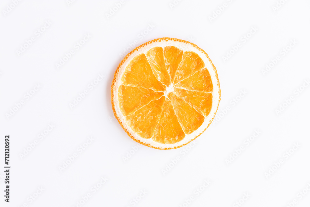 flat lay of a piece of dried round ripe orange. fruit chips on a white background. healthy sweets concept, diet, isolate, top view flat lay of a piece of dried round ripe orange. fruit chips on a white background. healthy sweets concept, diet, isolate, top view