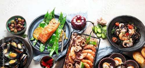 Assortment variousfish dishes - octopus, shrimp, crab, seafood, mussels, salmon. photo