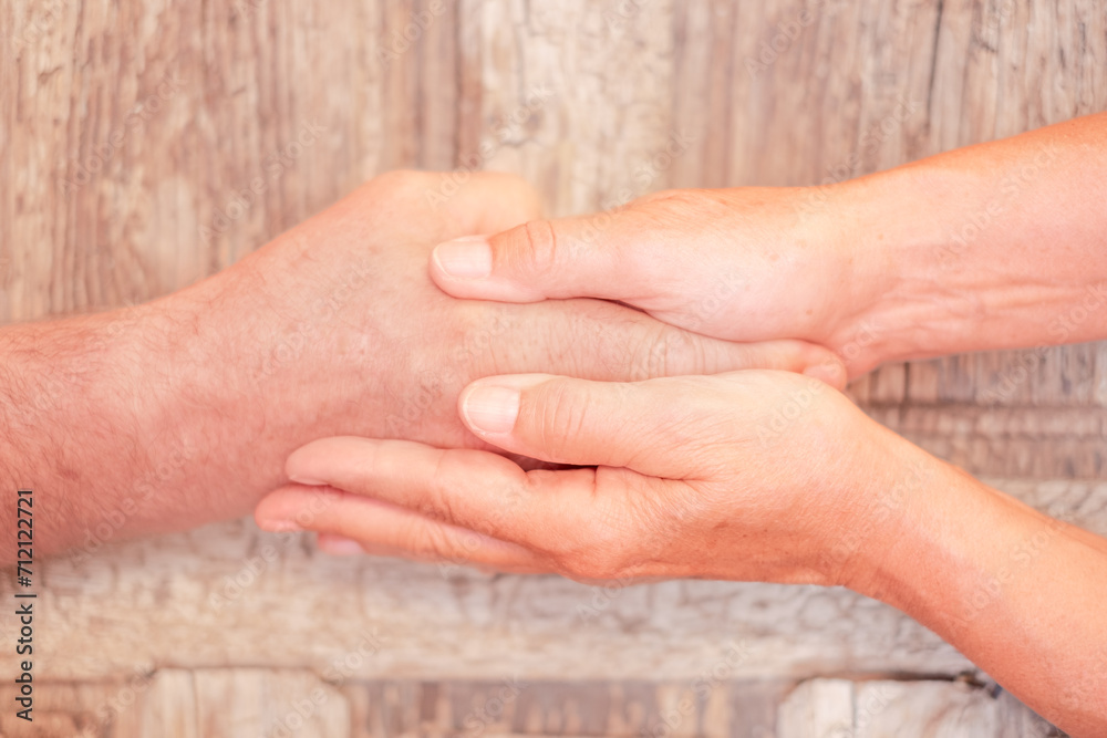 Fototapeta premium Close up on Seniors people holding hands together express care and psychological support, empathy, hope, concept of old people health care, group therapy