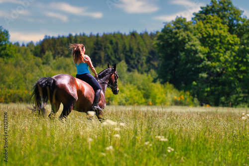 Woman women with horse riding horses on a summer meadow without a saddle. © RD-Fotografie