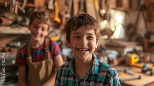 Happy smiling boys having fun in workshop